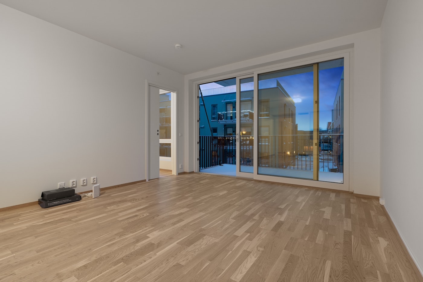An empty apartment with hardwood floors